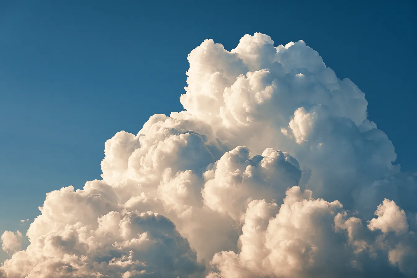 A monumental white cloud against a cobalt sky